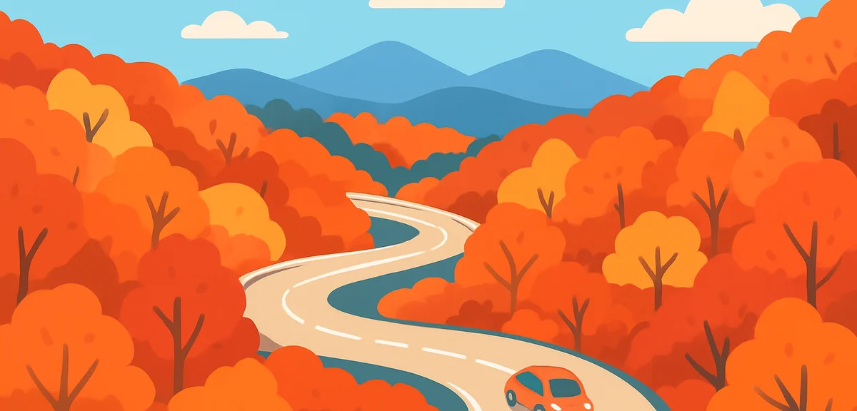 Aerial autumn view of Nikko Irohazaka winding mountain road surrounded by vivid red and orange maple