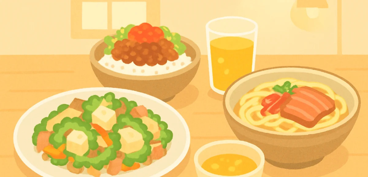 An Okinawan food spread on a wooden table, goya champuru, taco rice, Okinawa soba and a glass of san