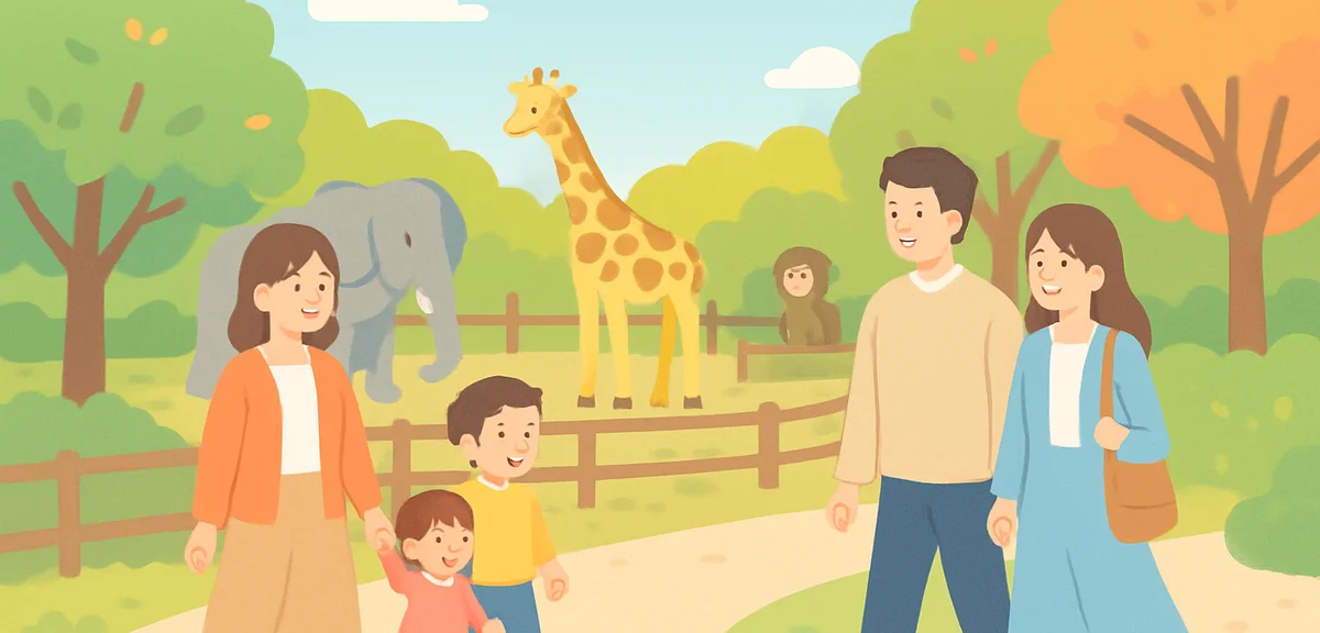 Families and couples walking along an outdoor zoo path in Japan during early autumn, animals visible